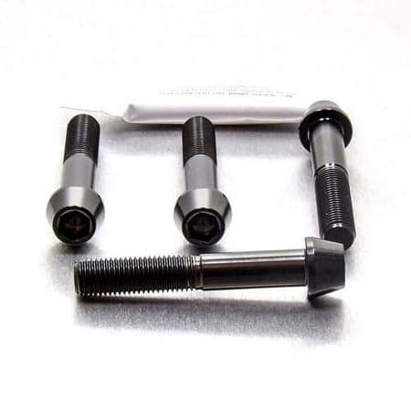 Pro-Bolt Titanium Front Brake Caliper Mounting Bolt Kit in black, featuring four sleek, durable bolts with a hexagonal socket head and a polished finish for enhanced performance.