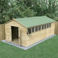 Wooden apex shed with double doors, green roof, and multiple windows, set on a concrete base in a garden.