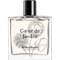 Clear glass bottle of Coeur De Jardin Eau de Parfum with floral illustrations and black cap.