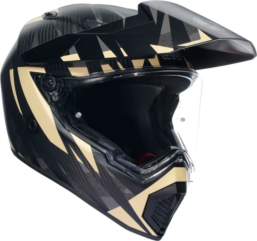 Black and beige AGV AX-9 Steppa 06 helmet in size L, featuring a sleek design with angular patterns, a clear visor, and a lightweight carbon fiber construction.