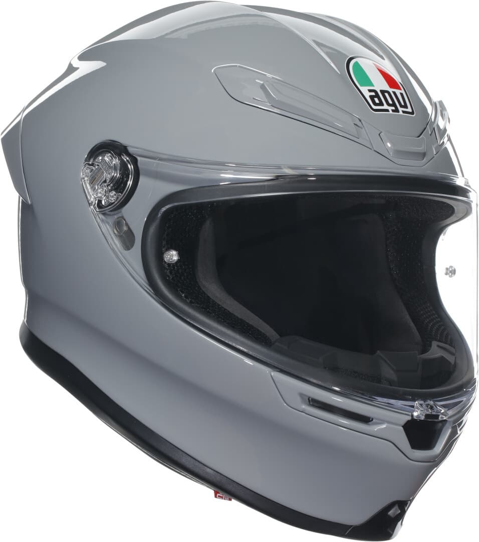 Full face helmet in light grey with a sleek design, featuring a clear visor, ventilation slots, and AGV logo on the front, size S.