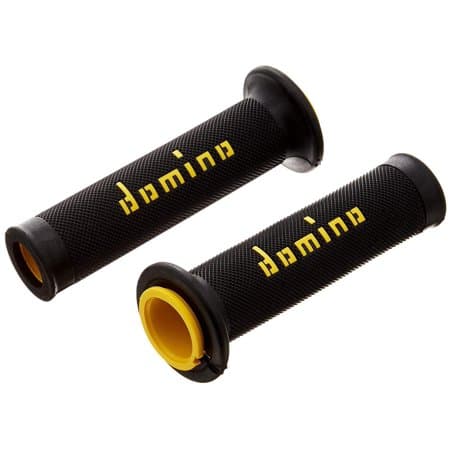 Black rubber handlebar grips with a textured surface, featuring yellow accents and the "Domino" logo prominently displayed in yellow on each grip.