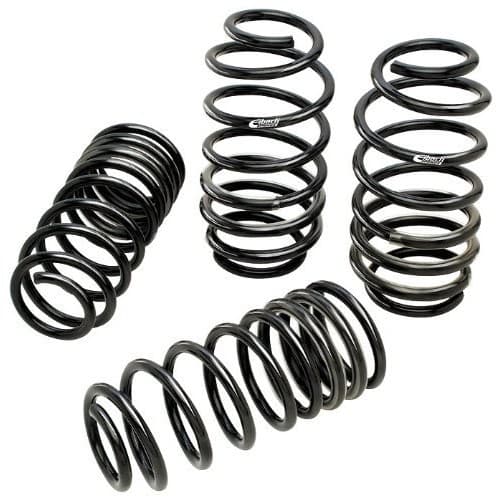 Black coilover springs arranged in a group, featuring a smooth finish and tightly wound coils, with a 2.250-inch inner diameter and a 700 lbs/in spring rate.