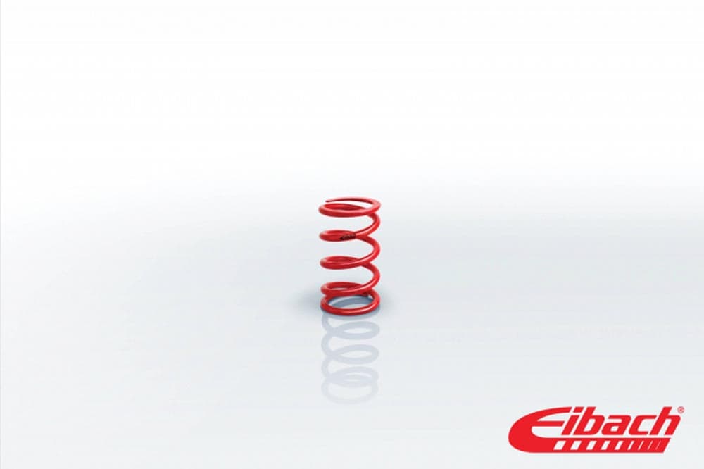 Red Eibach competition spring with a 60mm internal diameter, 3.15 inches in length, and a stiffness rating of 1027 lbs/in, featuring a smooth finish and tightly wound coils.