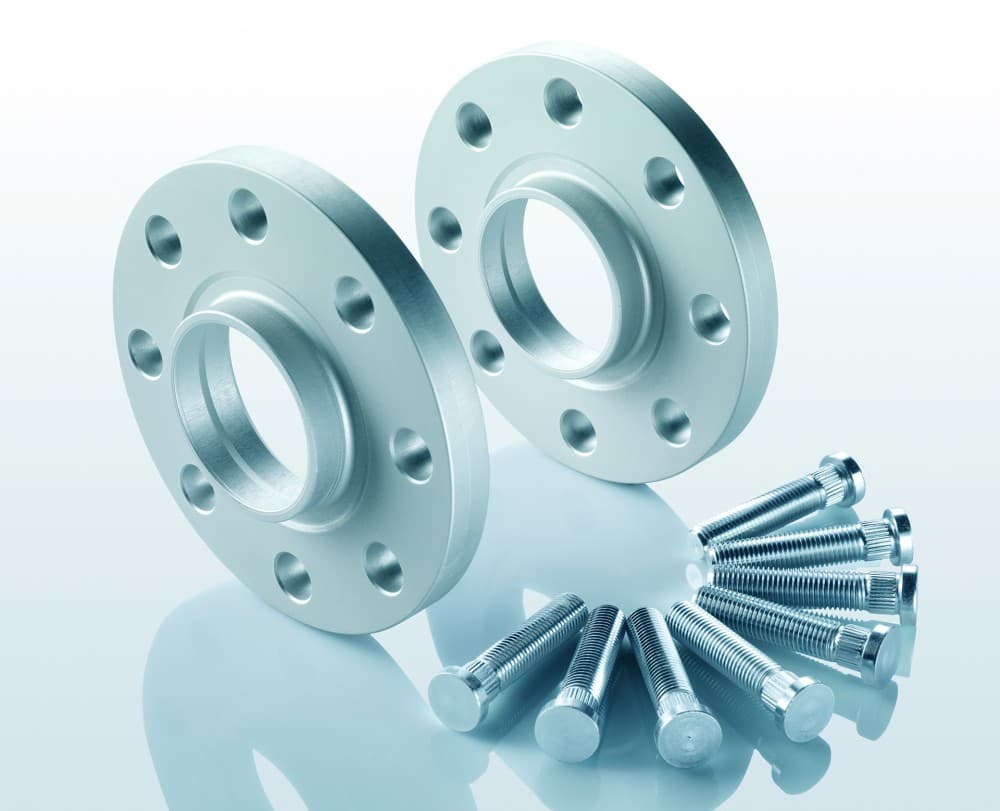 Silver aluminum track widening spacers with five holes each, accompanied by a set of silver bolts, designed to widen the axle track by 40mm.