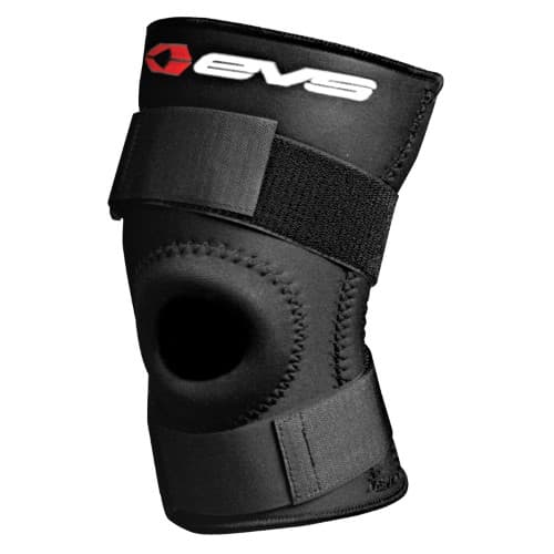 Black knee stabiliser made of neoprene with an open patella design, featuring adjustable Velcro straps and the EVS logo prominently displayed.