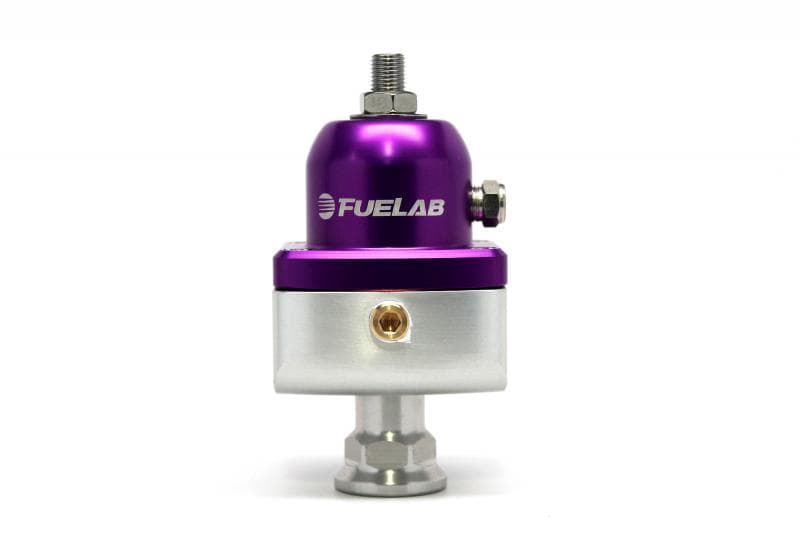 Purple and silver Fuelab Carburettor Blocking Style Fuel Pressure Regulator with a polished finish, featuring a top adjustment screw and a fuel inlet/outlet port.