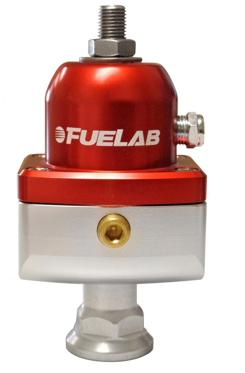 Red and silver Fuelab Carburettor Blocking Style Fuel Pressure Regulator (555xx Series) featuring a polished aluminum base, adjustable top, and a fuel inlet fitting.