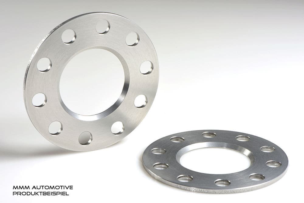 Silver aluminum wheel spacers with a smooth finish, featuring four holes and a central opening, designed for track widening by 10mm per axle.