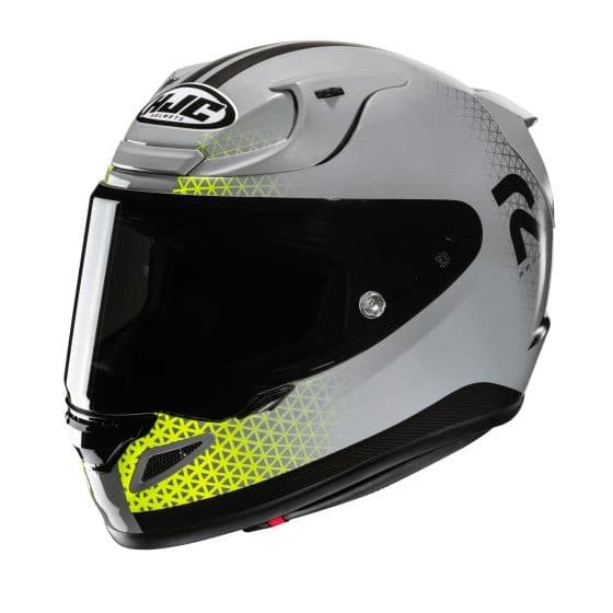 HJC RPHA 12 Enoth full face helmet in yellow and gray, featuring a sleek aerodynamic design, a tinted visor, and a distinctive geometric pattern on the shell.