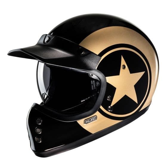 Black and gold full face motorcycle helmet featuring a prominent gold star design, a sleek visor, and ventilation ports, crafted from durable materials for safety and style.