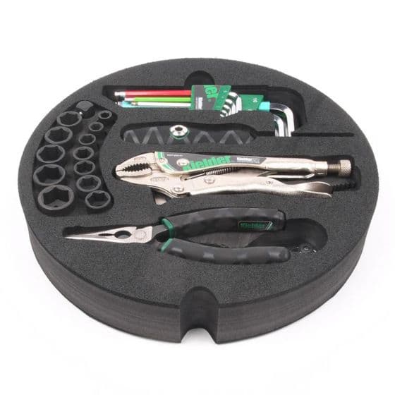 Kielder Layer Cake Hand Tool Kit in a round black foam case, featuring silver pliers, a variety of hex keys, and multiple socket sizes, all neatly organized.
