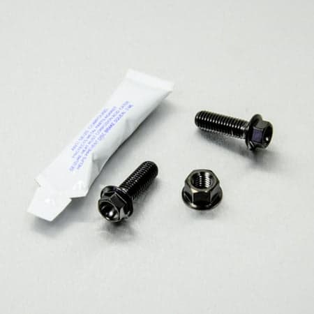 Pro-Bolt stainless steel engine mounting bolt kit featuring black bolts and nuts, accompanied by a small packet of thread-locking compound.