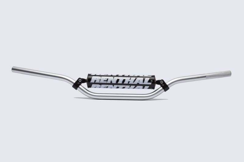 Silver aluminum handlebar with a black center section featuring bold white "RENTHAL" branding, designed for MX and Enduro bikes, measuring 7/8 inches in diameter.