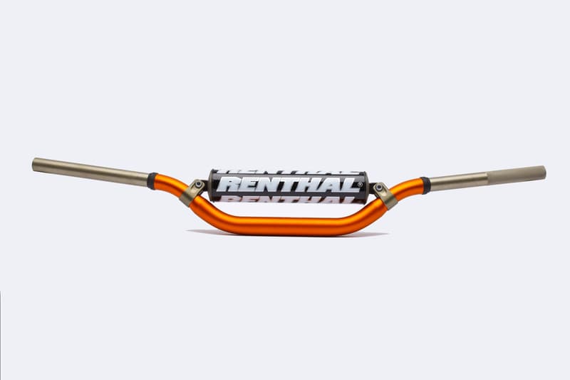 High handlebar featuring a distinctive orange and silver color scheme, constructed from lightweight aluminum, with Renthal branding prominently displayed on the center.