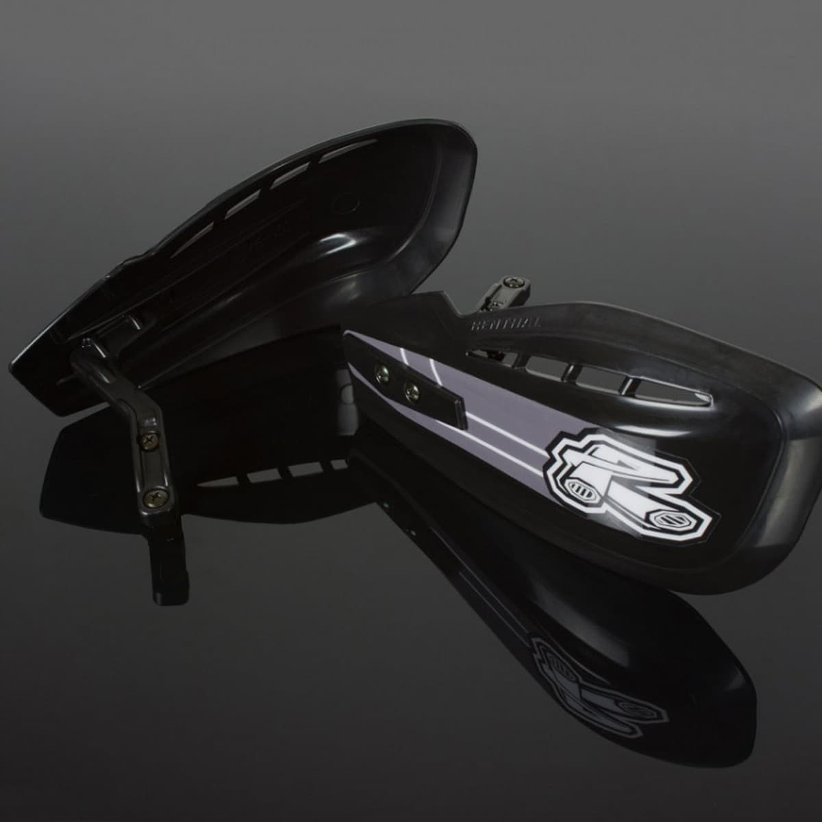 Black Renthal Propagcia MX handguards with a sleek design, featuring a silver stripe and logo, made from durable material, ideal for motocross protection.