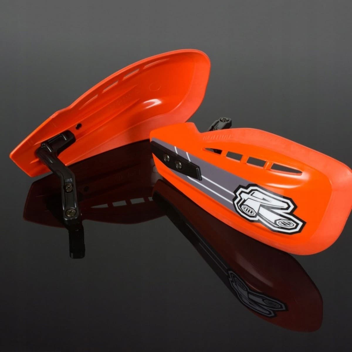 Orange Renthal Propagcia MX handguards with a sleek design, featuring a black mounting bracket and a prominent Renthal logo in silver.