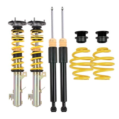 ST Suspension XTA Coilover Kit featuring yellow springs, black shock absorbers, adjustable top mounts, and components for lowering front 30-55mm and rear 30-60mm.