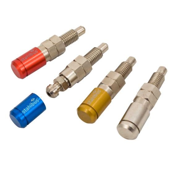 Four Stahlbus bleeder valve caps in various colors—red, blue, yellow, and grey—featuring a metallic finish with a rounded top and threaded base for easy installation.