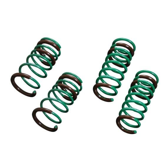 Tein S.Tech Spring Kit featuring four coil springs, with a vibrant green finish and brown accents, designed to lower the front by 15mm and the rear by 30mm.