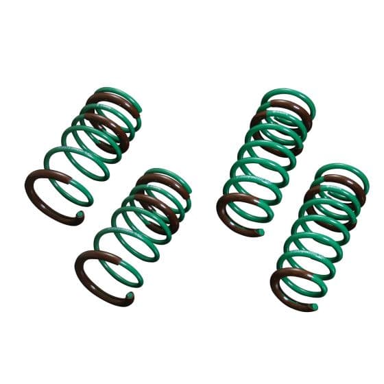 Tein S.Tech Spring Kit featuring four coil springs, with a vibrant green finish and dark brown accents, designed to lower vehicle height by 44mm in the front and 25mm in the rear.