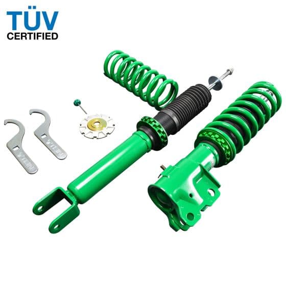 Green Tein Street Advance Z coilovers featuring adjustable springs, a black shock absorber, and included installation tools, designed to lower front by 40mm and rear by 15mm.