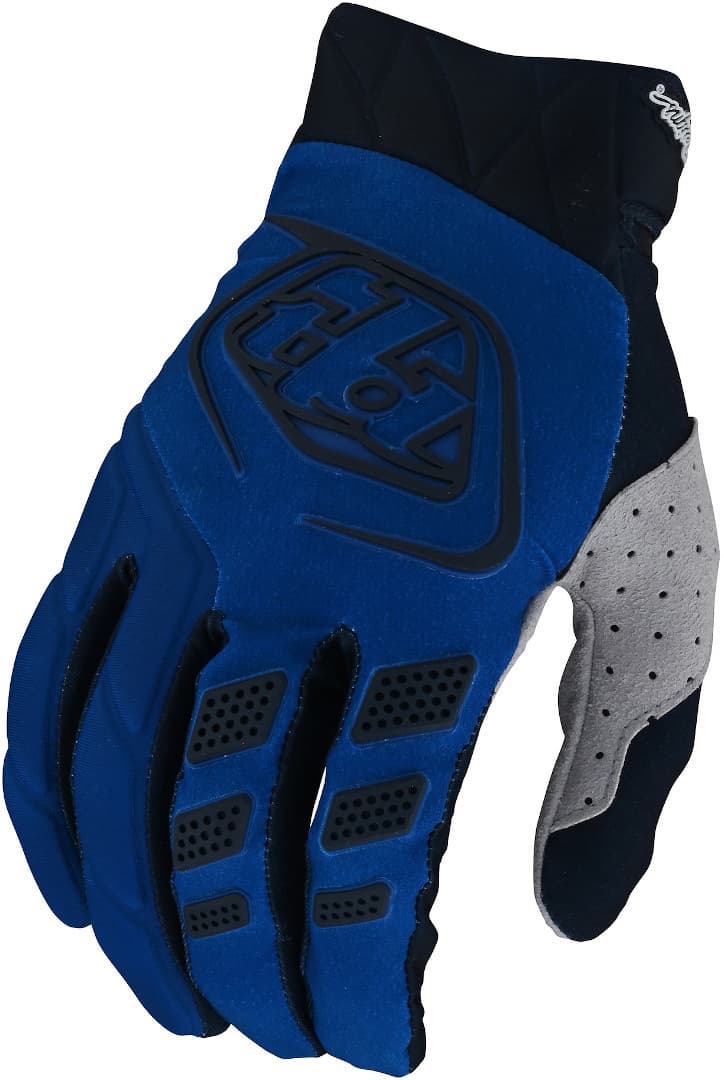 Troy Lee Designs Revox motocross gloves in blue and black, featuring a textured grip, breathable material, and padded knuckles for enhanced protection and comfort.