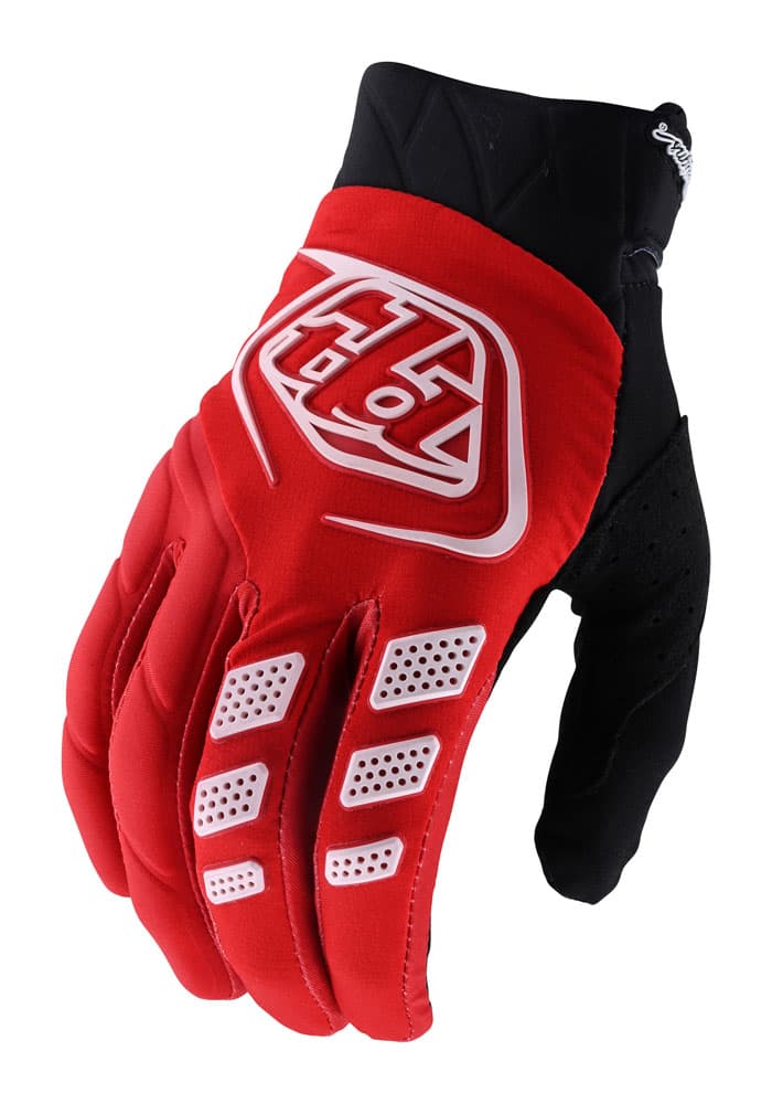Red Troy Lee Designs Revox motocross gloves in medium size, featuring a sleek design, padded knuckles, perforated sections for breathability, and a black accent on the palm.