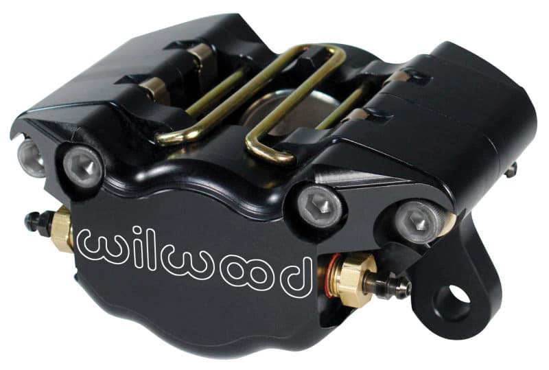Black anodized aluminum brake caliper with gold mounting hardware, featuring dual pistons and a distinctive Wilwood logo, designed for 0.38 in. disc compatibility.