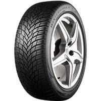 Firestone Winterhawk 4 tire, 235/65 R17, black with V-shaped tread pattern and silver alloy wheel.