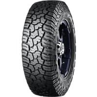 Yokohama Geolandar X-AT tire, aggressive tread pattern, black sidewall, raised white lettering, LT245/65 R17 size.