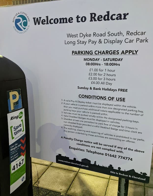 Welcome to Redcar sign with parking charges details and Pay & Display machine at West Dyke Road South Car Park.