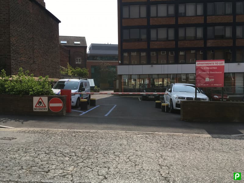 Pay & Display parking area with a "No Entry" sign, vehicles, and a building labeled "Apartments to Let" in York.