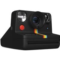 Black Polaroid Now+ Gen 2 instant camera with rainbow stripe, red shutter, and dual lens system at front right angle.