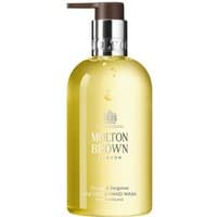 Molton Brown Orange & Bergamot hand wash, clear pump bottle with amber liquid, silver label, 300 ml size.